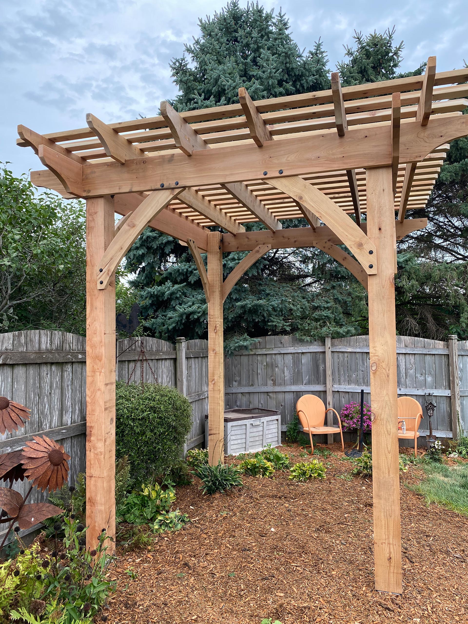 wooden pergola atop of mulch